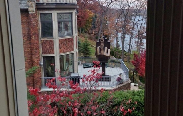 Rich Man Buys House Next To His Ex Wife & Puts Up Middle Finger Statue Outside [Funny]